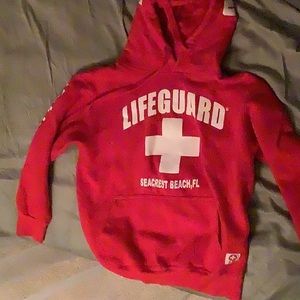 I don’t know the brand, but it is a red lifeguard hoodie!